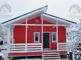 Скандинавский каркасный дом 7 на 11 с террасой, две спальни, кухня-гостиная. Цвет стен фасада RAL3020